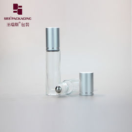 Botella de perfume de 10 ml de vidrio vacío transparente y transparente en una bola de metal